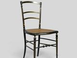 a black chair with a wooden seat on a gray background