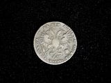 an image of a silver coin with a bird on it
