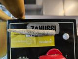 a close up of a sign with a cigarette on it