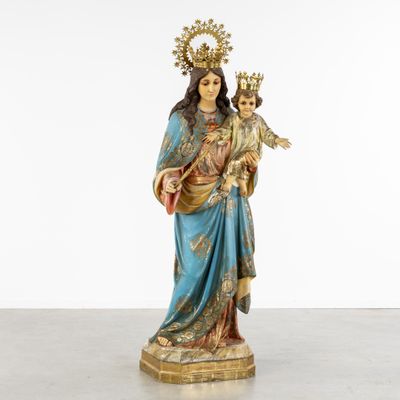 a statue of a woman holding a child in her arms