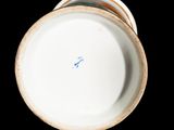a close up view of a white plate with a blue line on it