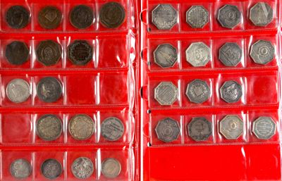many different types of coins in a red case
