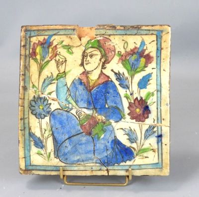 a picture of a tile with a woman sitting on it