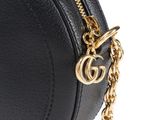 a close up of a black purse with a gold chain