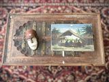 a picture of a man with a hat on and a picture of a house