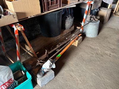 a pile of skis and ski poles in a garage