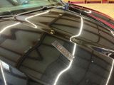 a car that has a sticker on the hood of it