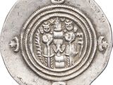 a close up of a silver coin with an image of a man on a horse
