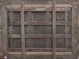 an old window with a wooden frame on the outside