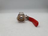 a close up of a red hose with a red handle