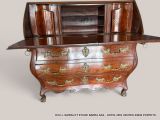 a wooden desk with a mirror on top of it