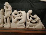a group of sculptures that are sitting on a shelf