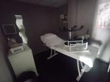 a room with a table and a chair in it