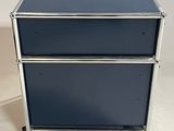 the two drawers are made of metal and are blue