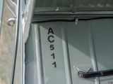 a close up of a car door with the word acustt written on it