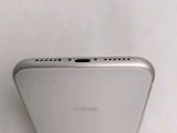 a close up view of the back of a white iphone