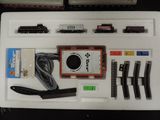 a white tray with a train set and other items on it