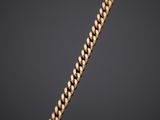 a gold chain on a black background