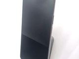 a cell phone that is sitting on top of a stand
