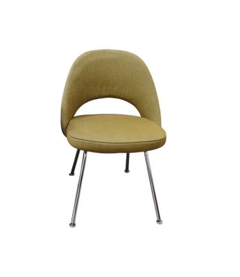 the saarik chair with chrome legs is upholstered and has a mustard colored upholstered seat