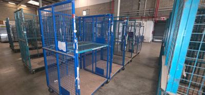 many cages that are in a building with a lot of them