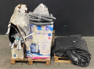 a pile of garbage sitting on a pallet next to a black bag