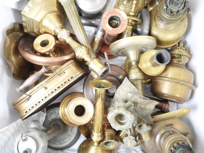 many different types of brass pipes and valves in a box