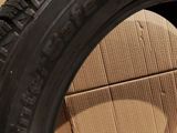 tires are stacked on top of cardboard boxes in a room