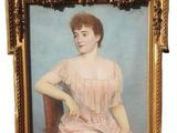 portrait of a woman in a pink dress sitting on a red chair