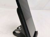a cell phone that is sitting on top of a stand