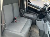 the interior of a van with two seats and a steering wheel