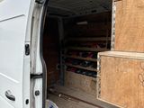 a white van with a bunch of boxes in the back of it