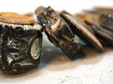 a close up of a group of wooden beads on a table