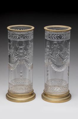 a pair of cut glass vases with gold rims