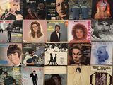 a lot of music covers on the wall of a room