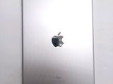 an apple ipad sitting on top of a white table next to a white wall