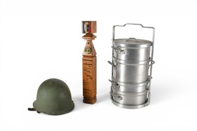 a toy soldier ' s helmet and a metal container