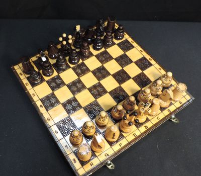 a chess board that has a lot of chess pieces on it