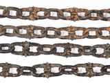 several chains of various sizes and shapes are shown on a white surface
