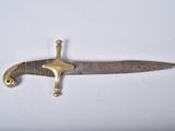 an image of a knife that is on a white surface