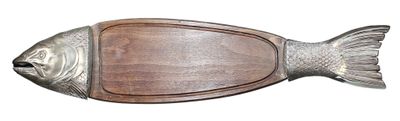 a fish shaped cutting board with a wooden board on it