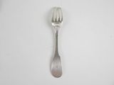a silver spoon with a fork sticking out of it