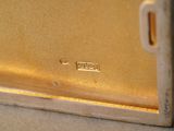 a close up of a gold plate on a table