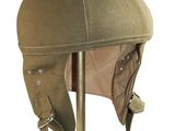 brown leather helmet on a stand on a white background