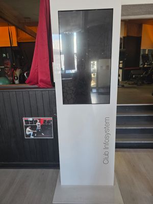 a white display with a red curtain in the background