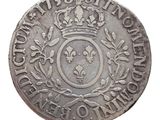 gros plan d'une pièce de monnaie surmontée d'une couronne