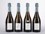 trois bouteilles de vin posées l'une à côté de l'autre sur une table
