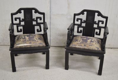 pair of asian style chairs with upholstered arms and back cushions
