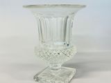 a close up of a clear glass vase on a clear surface