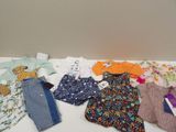a lot of clothes that are on a table